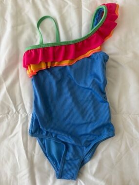 Fits like 5T. One piece fun swim!